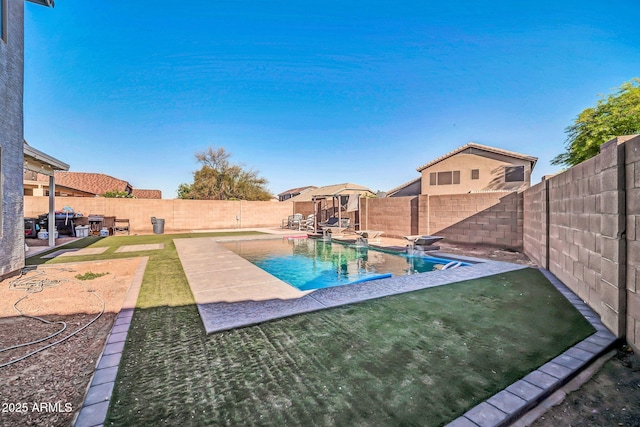 view of pool with a patio, a fenced in pool, and a fenced backyard