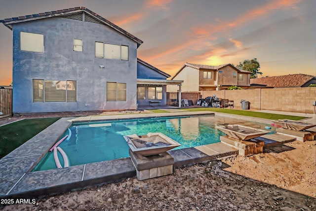 view of swimming pool with a fenced backyard, a fenced in pool, and a patio