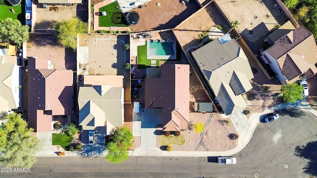 birds eye view of property with a residential view