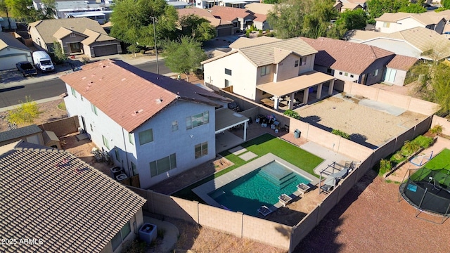birds eye view of property with a residential view