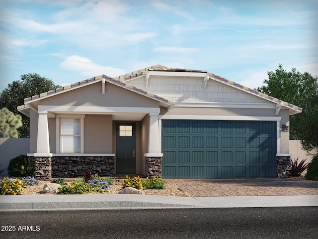 17595 W Monroe St, Goodyear, AZ 85338 - craftsman inspired home featuring stone siding, a garage, decorative driveway, and stucco siding