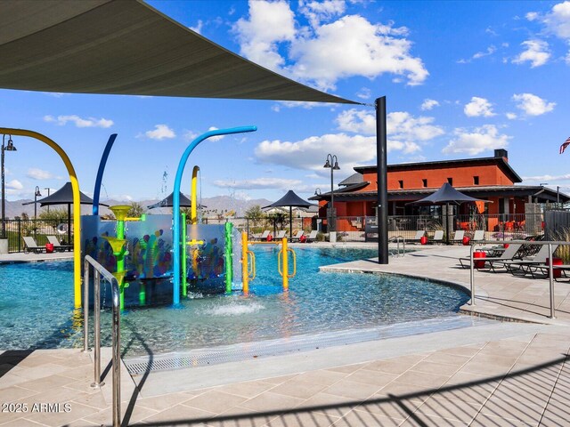 17595 W Monroe St, Goodyear, AZ 85338 - community pool with a water play area and a patio area