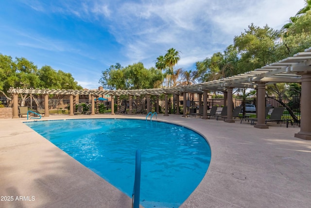community pool with a pergola, fence, and a patio