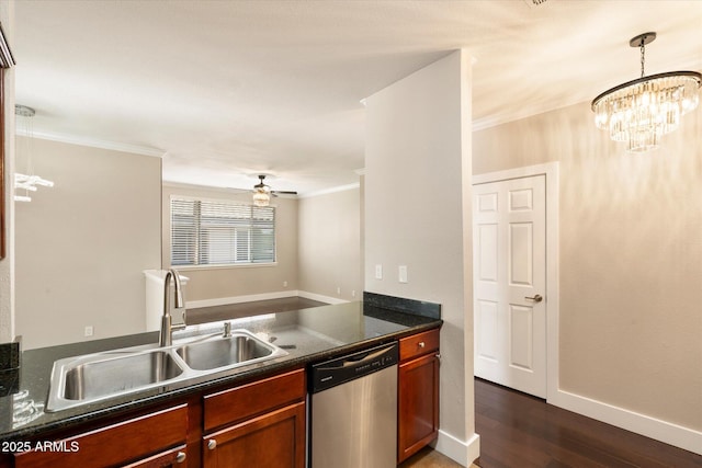 kitchen with crown molding, dark wood finished floors, a sink, dark countertops, and dishwasher