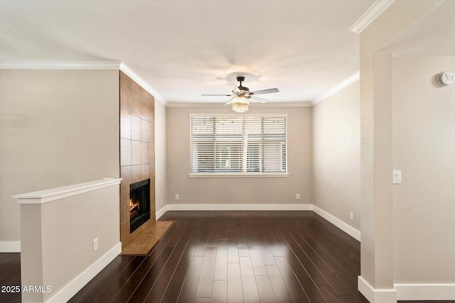 unfurnished living room with dark wood-style floors, ceiling fan, ornamental molding, and baseboards