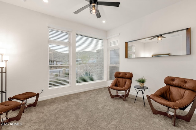 sitting room featuring a ceiling fan, carpet, baseboards, and recessed lighting