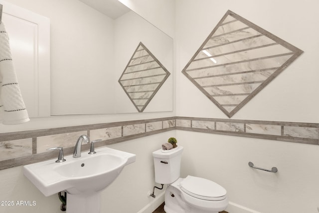 bathroom with a sink and toilet