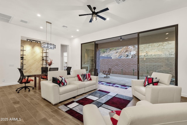 living area featuring recessed lighting, visible vents, ceiling fan, and wood finished floors