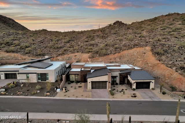 drone / aerial view featuring a mountain view