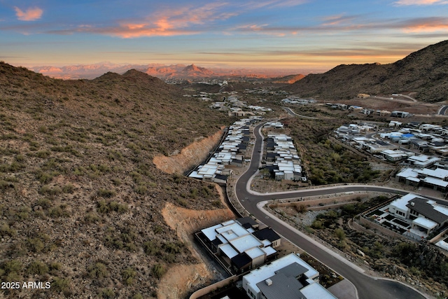 birds eye view of property featuring a mountain view