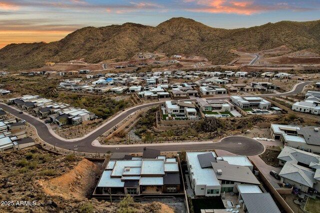 aerial view at dusk with a residential view and a mountain view