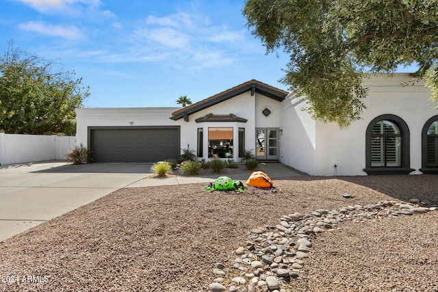 single story home featuring a garage