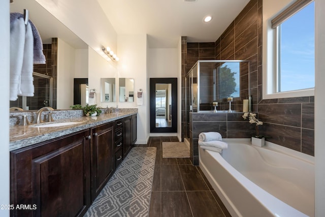 7432 W Bronco Trl, Peoria, AZ 85383 - full bath featuring a shower stall, a garden tub, double vanity, tile patterned flooring, and recessed lighting