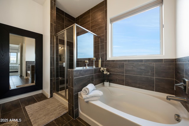 7432 W Bronco Trl, Peoria, AZ 85383 - bathroom with a bath and a stall shower