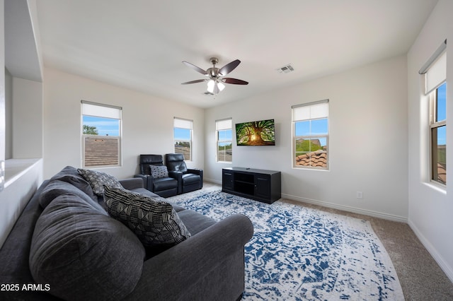 7432 W Bronco Trl, Peoria, AZ 85383 - living room featuring plenty of natural light, a ceiling fan, carpet floors, and baseboards