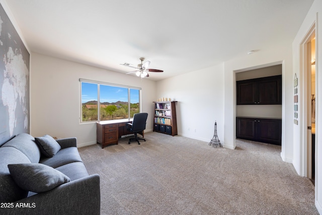 7432 W Bronco Trl, Peoria, AZ 85383 - home office with a ceiling fan, light carpet, and baseboards
