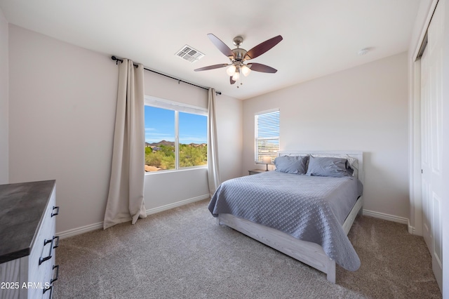 7432 W Bronco Trl, Peoria, AZ 85383 - bedroom with light colored carpet, baseboards, and ceiling fan