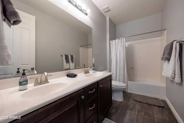 7432 W Bronco Trl, Peoria, AZ 85383 - bathroom featuring double vanity, toilet, shower / tub combo, and baseboards