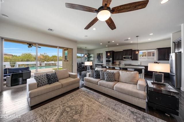 7432 W Bronco Trl, Peoria, AZ 85383 - living area with ceiling fan, recessed lighting, and wood finished floors