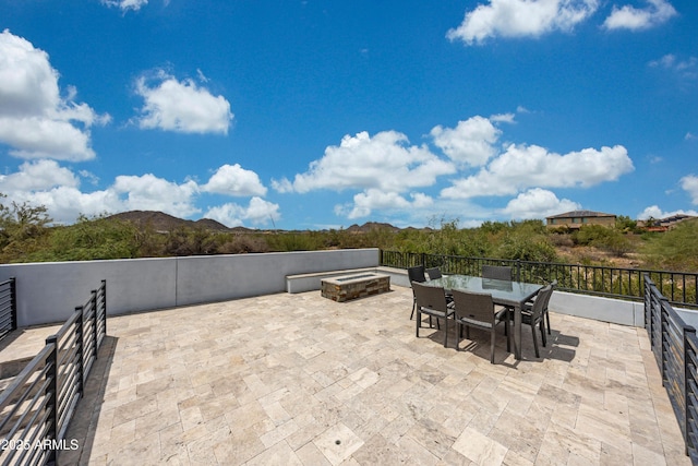 7432 W Bronco Trl, Peoria, AZ 85383 - view of patio with outdoor dining area, a mountain view, and a jacuzzi