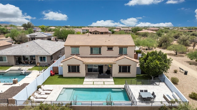 7432 W Bronco Trl, Peoria, AZ 85383 - rear view of house with stucco siding, a tile roof, a patio area, and a residential view