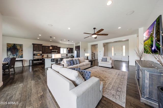 7432 W Bronco Trl, Peoria, AZ 85383 - living area with ceiling fan, dark wood-style floors, recessed lighting, and baseboards