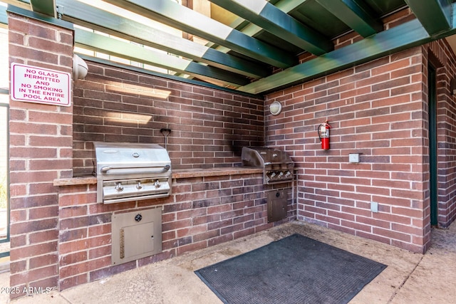 view of patio featuring an outdoor kitchen and area for grilling