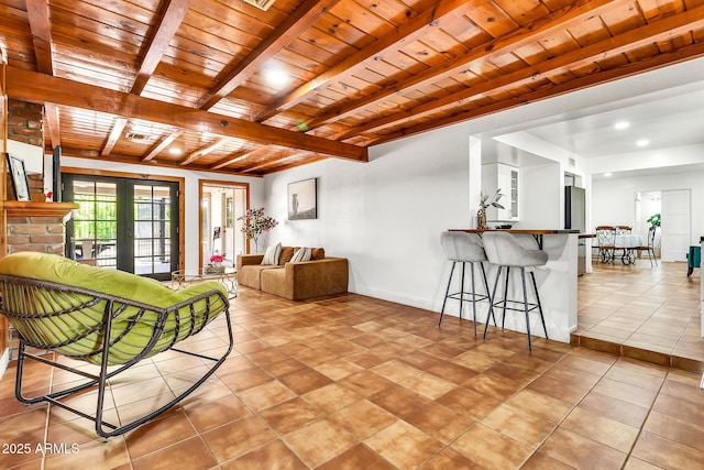 1451 E Brown Rd, Mesa, AZ 85203 - living room featuring light tile patterned floors, wood ceiling, baseboards, and beamed ceiling