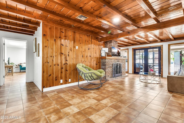 1451 E Brown Rd, Mesa, AZ 85203 - unfurnished room featuring wood ceiling, a fireplace, and beamed ceiling