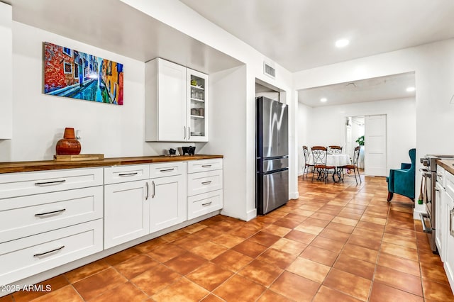 1451 E Brown Rd, Mesa, AZ 85203 - kitchen featuring visible vents, butcher block counters, recessed lighting, white cabinets, and stainless steel appliances