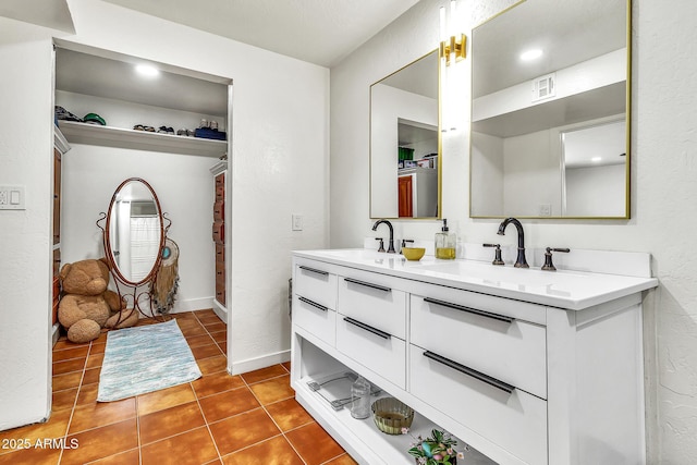 1451 E Brown Rd, Mesa, AZ 85203 - full bath featuring double vanity, visible vents, a sink, and tile patterned flooring