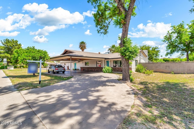 1451 E Brown Rd, Mesa, AZ 85203 - ranch-style house featuring stucco siding, fence, an attached carport, and concrete driveway