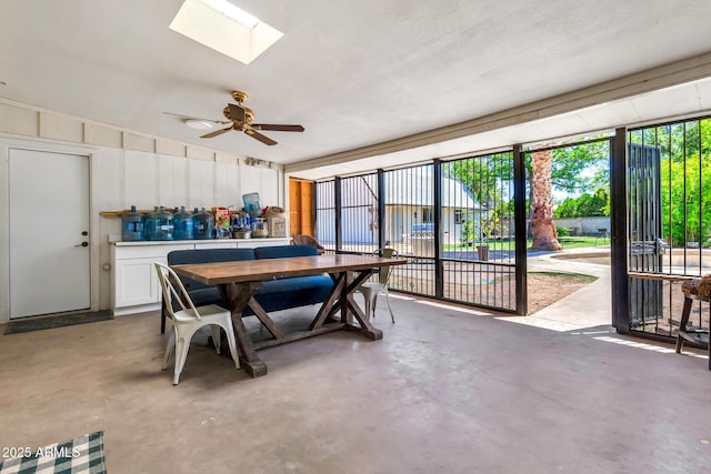 1451 E Brown Rd, Mesa, AZ 85203 - dining area with a skylight, a ceiling fan, and concrete flooring