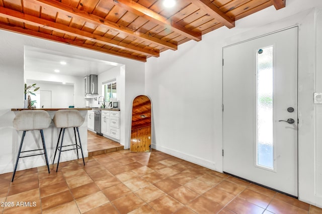 1451 E Brown Rd, Mesa, AZ 85203 - foyer entrance featuring light tile patterned floors, wooden ceiling, beam ceiling, and a wealth of natural light