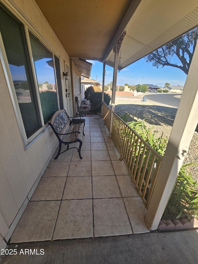 balcony featuring covered porch