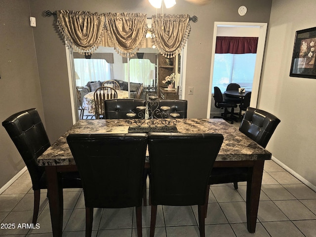 dining area with tile patterned flooring