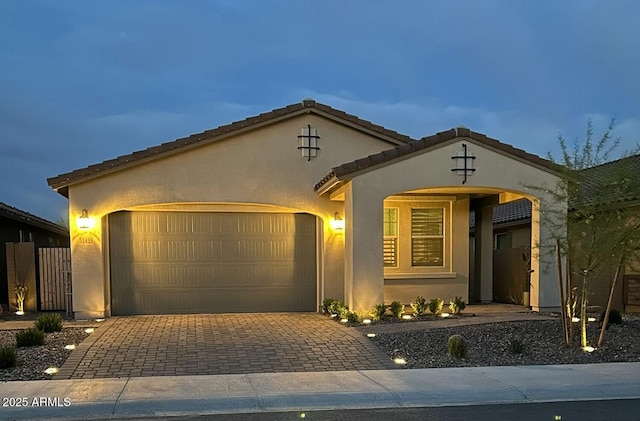 31435 N 130th Ave, Peoria, AZ 85383 - view of front of home with a garage, stucco siding, and decorative driveway