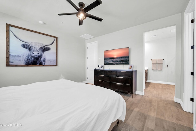 31435 N 130th Ave, Peoria, AZ 85383 - bedroom with baseboards, a ceiling fan, and wood finished floors