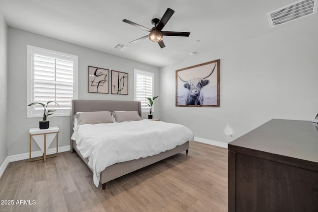 31435 N 130th Ave, Peoria, AZ 85383 - bedroom with light wood-type flooring, visible vents, and baseboards