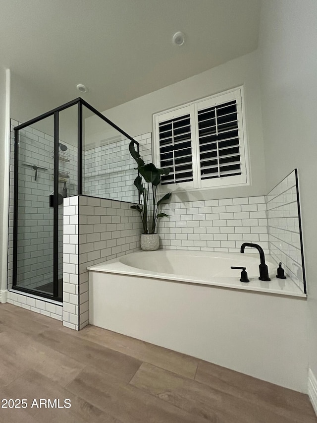 31435 N 130th Ave, Peoria, AZ 85383 - full bathroom with a shower stall, tasteful backsplash, a bath, and wood finished floors