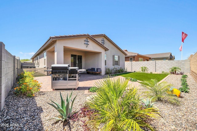 31435 N 130th Ave, Peoria, AZ 85383 - back of property featuring a tile roof, a fenced backyard, a patio, and stucco siding