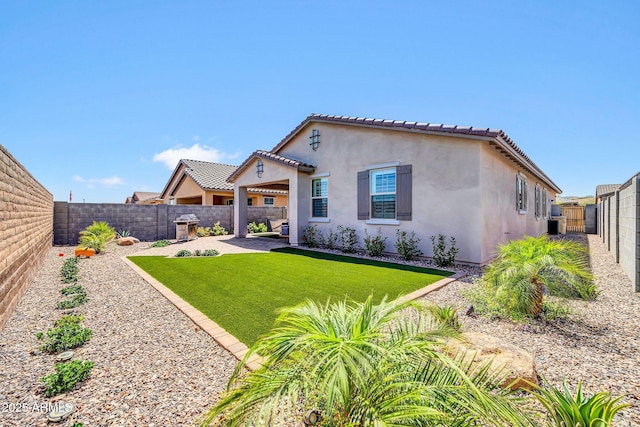 31435 N 130th Ave, Peoria, AZ 85383 - view of front of property featuring stucco siding, a tile roof, a patio, and a fenced backyard