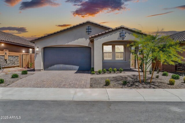 31435 N 130th Ave, Peoria, AZ 85383 - mediterranean / spanish-style house featuring a tile roof, driveway, fence, a garage, and stucco siding