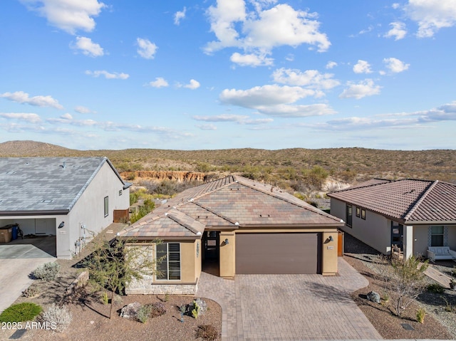 ranch-style home featuring a garage