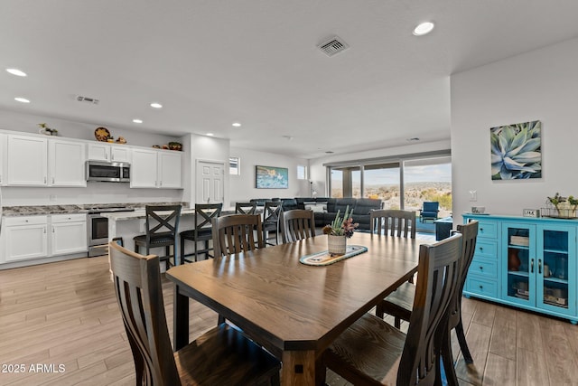 dining area featuring light hardwood / wood-style flooring