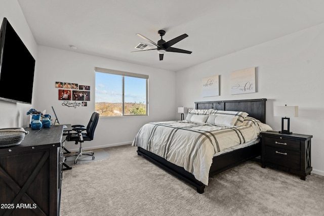 bedroom featuring ceiling fan and light carpet