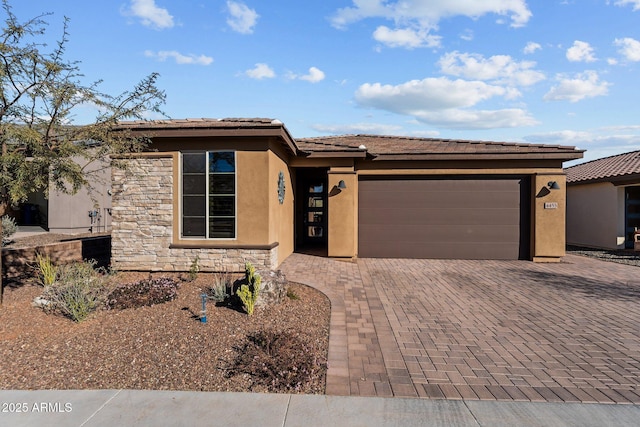 prairie-style home featuring a garage