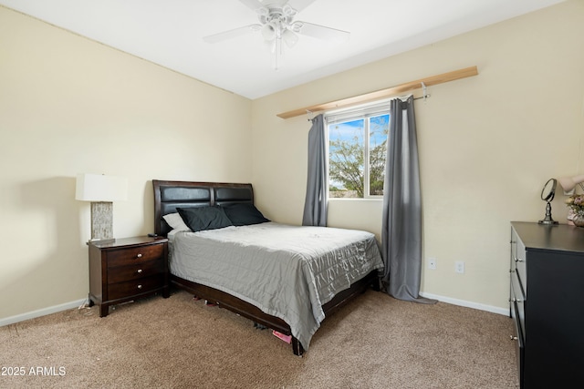 bedroom with a ceiling fan, light colored carpet, and baseboards