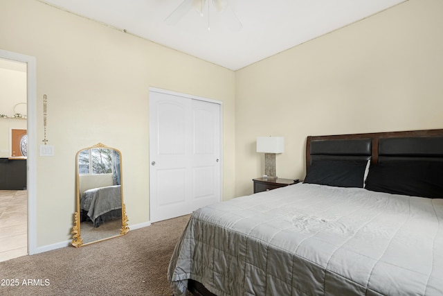 bedroom with baseboards, carpet, and a ceiling fan