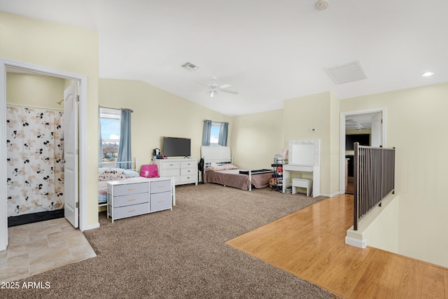 bedroom with visible vents, lofted ceiling, carpet, and ceiling fan